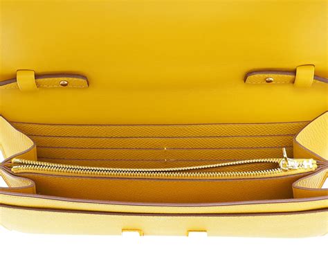 hermes jaune ambre constance|Hermes constance lizard purse.